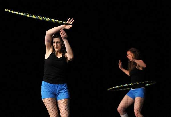 Twistin Vixens hoop dance on stage at talent show