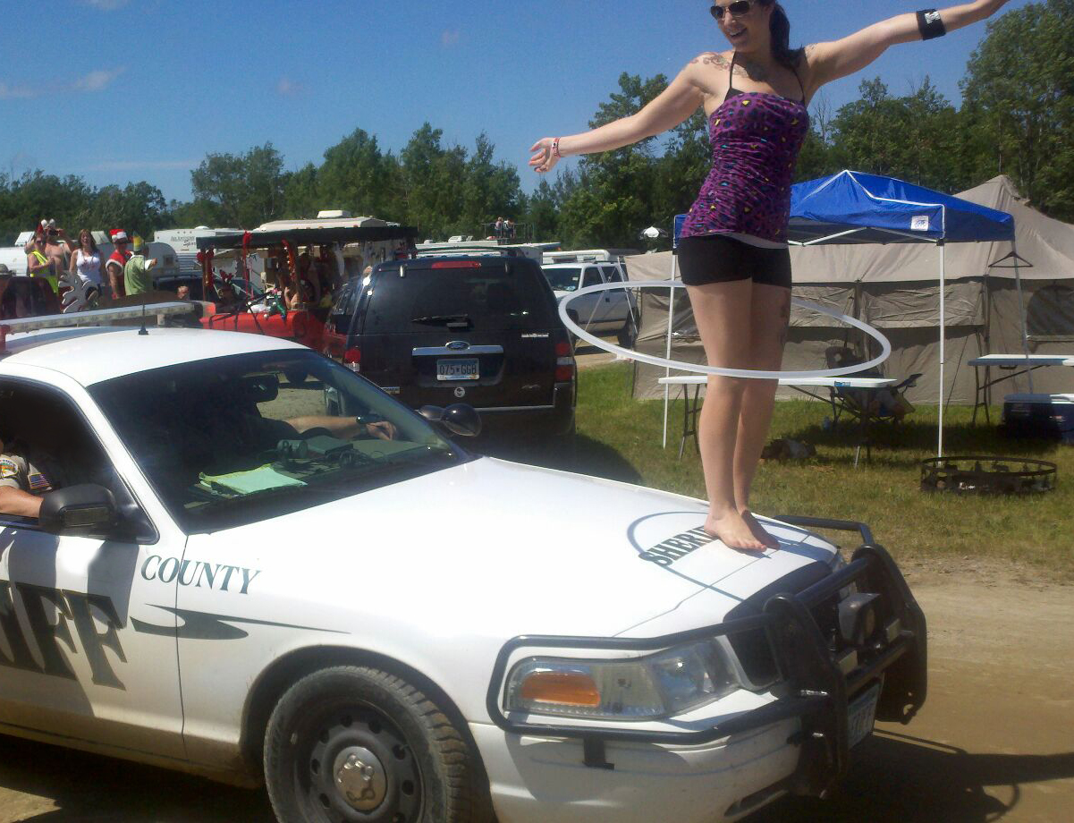 Moondance Jam Hula Hooper on a Police Car