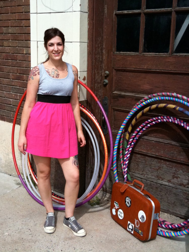 Hula hooper posing with hoops