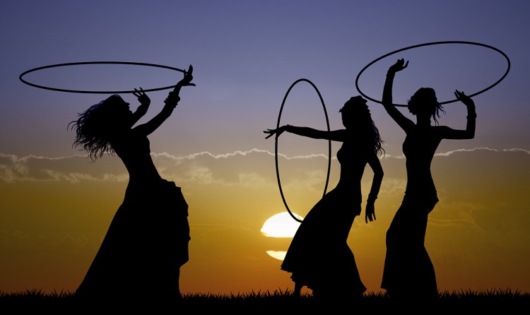 Hawaiian hoop dancers sunset